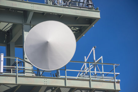 Detail of a telecommunication tower with directional mobile phone and internet antennas. Wireless communication equipment transmitter. 5G Technology.の写真素材