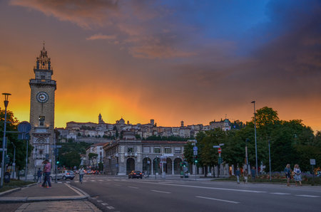 Colorful sunset in Bergamo, famous tourist destination in Lombardy, Italy. View to upper town with dramatic sky.の写真素材