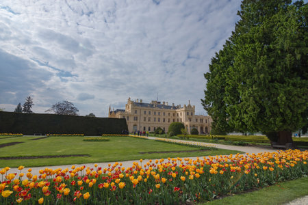 Lednice/Czech Republic - April 30, 2017: View of Lednice castle with beautiful park and garden in spring, Neo-gothic palace in South Moravia region, famous travel wine destinationのeditorial素材
