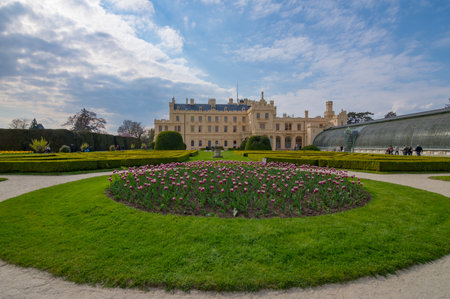 Lednice/Czech Republic - April 30, 2017: View of Lednice castle with beautiful park and garden in spring, Neo-gothic palace in South Moravia region, famous travel wine destinationのeditorial素材