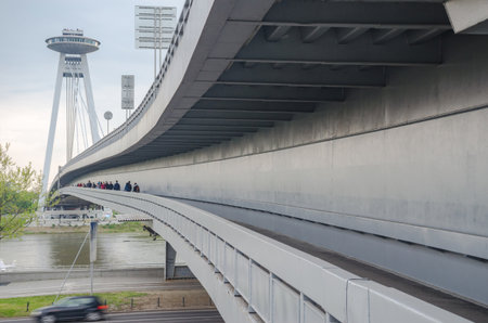 Bratislava/Slovakia - April 29, 2017: The famous UFO Bridge (New bridge SNP), a modern road bridge over the Danube riverのeditorial素材