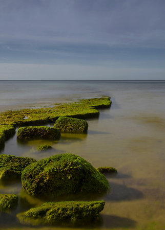 Flanked by tall cliffs, the lovely Porto de MÃ³s Beach is like a long tongue of golden sand. At...