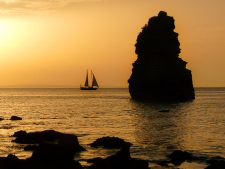 Do Camilo Beach (Praia do Camilo) is a picturesque little beach, pretty quiet and secluded with some amazing rock formations and wonderful views from the top, in Lagos,Western Algarve coast, Portugal.の写真素材