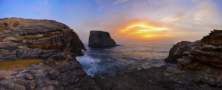 Wild and undiscovered beaches and cliffs in the Algarve's West Coast, near Lagos, Portugal, at sunset.の写真素材