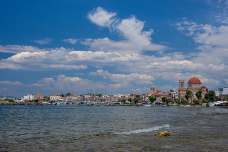 Clear waters of Mediterranean sea and a beautiful view of Aegina town in Aegina island, Saronic gulf, Greece.の写真素材