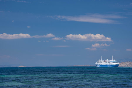 Ferry boat and the blue Mediterranean sea in the Saronic gulf, Greece.の写真素材