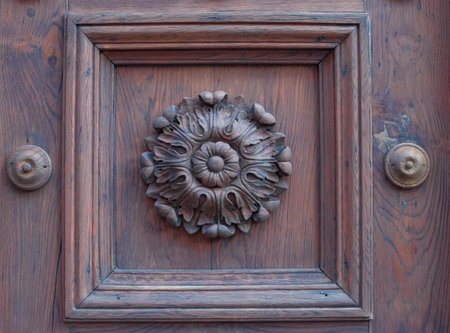 Old decorative wooden door detail in Graz, Styria region, Austriaの写真素材