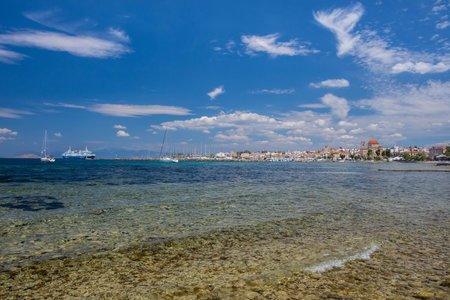 Clear waters of Mediterranean sea and a beautiful view of Aegina town in Aegina island, Saronic gulf, Greece.の写真素材