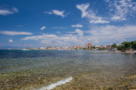 Clear waters of Mediterranean sea and a beautiful view of Aegina town in Aegina island, Saronic gulf, Greece.の写真素材