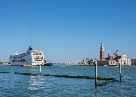 Venice, Italy - April 20, 2019: Cruise ship MSC Lirica of the company MSC Cruises and San Giorgio di Maggiore church in the backgroundのeditorial素材