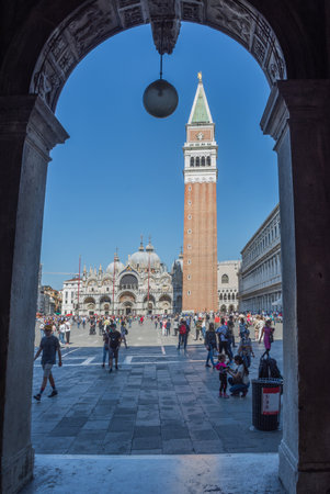 Venice, Italy - April 20, 2019: View of Saint Mark square (San Marco), with Doges Palace (Palazzo Ducale), bell tower (campanile) and Basilica di San Marco, in a beautiful sunny day.のeditorial素材