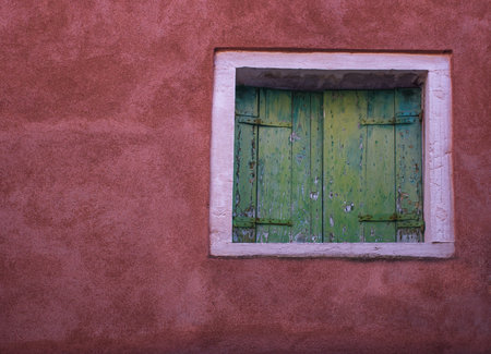 Old vintage green window in Venice, Italy.の写真素材