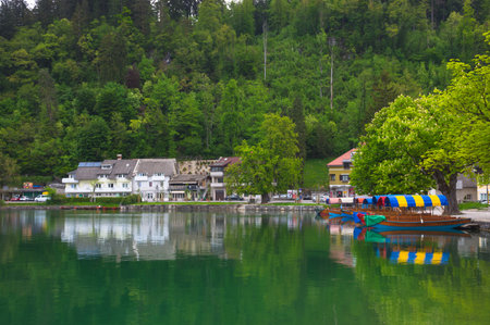 Bled/Slovenia - May 01, 2018: Traditional Pletna boats waiting for tourists on Lake Bled, famous attraction in Sloveniaのeditorial素材