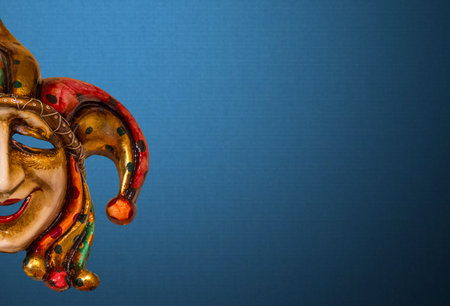 Traditional Venetian mask on the streets of Venice, Italy, isolated on colorful background.の写真素材