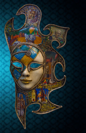 Traditional Venetian mask on the streets of Venice, Italy, isolated on colorful background.の写真素材