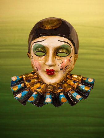 Traditional Venetian mask on the streets of Venice, Italy, isolated on colorful background.の写真素材