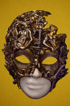 Traditional Venetian mask on the streets of Venice, Italy, isolated on colorful background.の写真素材