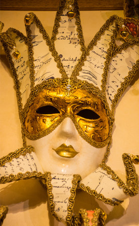 Traditional Venetian mask on the streets of Venice, Italy, isolated on colorful background.の写真素材
