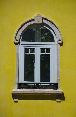 Windows and yellow colored facade building in Lisbon, Portugalの写真素材