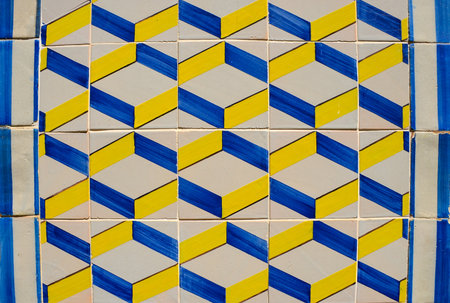 Ornamental old typical tiles from Portugal called "azulejos" made with colored ceramic tiles, who decorates the houses in Lisbon, Portugalの写真素材
