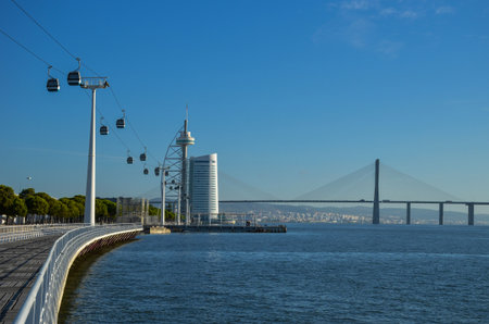 Telecabines (cable cars) at Park of Nations (Parque das Nacoes) and Vasco da Gama Bridge over the Tagus River, in Lisbon, Portugal.の写真素材