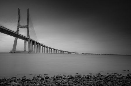 Sunrise at Vasco da Gama Bridge, the longest bridge in Europe, who spans the Tagus River, in Lisbon, Portugal.の写真素材
