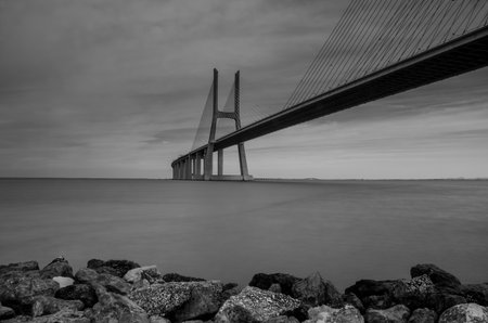 Sunrise at Vasco da Gama Bridge, the longest bridge in Europe, who spans the Tagus River, in Lisbon, Portugal.の写真素材