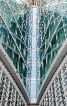 Milan/Italy- July 10, 2016: architectural detail of the modern glass Lombardy Building (Palazzo Lombardia), a 161 m tall skyscraper and the main seat of the government of Lombardyのeditorial素材