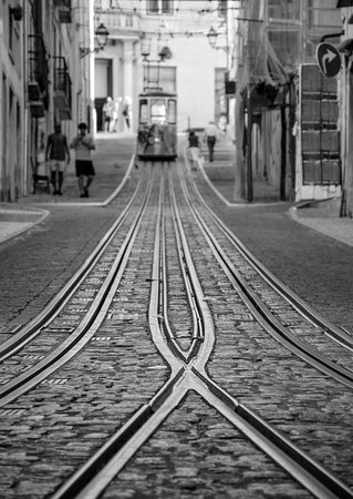 Famous Bica Funicular (Elevador da Bica or Ascensor da Bica), the third oldest of all, inaugurated in 1892, in district of Baixa-Chiado, Lisbon, Portugal. Selective focus on the rails.の写真素材