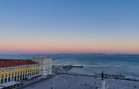 Commerce square (Praca do Comercio) and statue of King Jose I from Rua Augusta Arch fabulous viewpoint, at dawn, in Lisbon, Portugalの写真素材