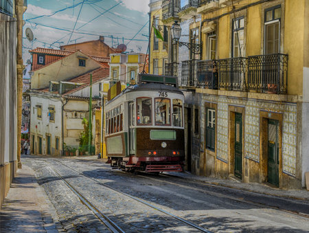 Vintage yellow tram in the city center of Lisbon, Portugalの写真素材