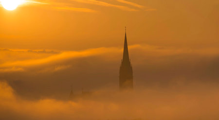 Cityscape of Graz with Church of the Sacred Heart of Jesus and historic buildings, in Graz, Styria region, Austria, at sunrise. Beautiful foggy morning over the city of Graz, in autumnの写真素材
