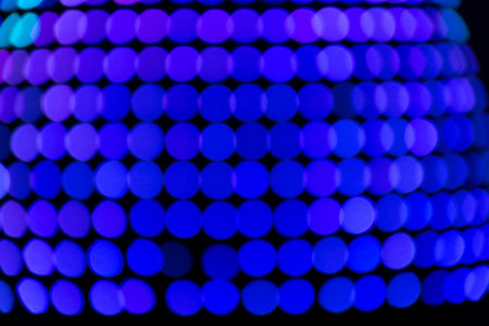Colorful abstract bokeh background. Winter decorations, at night.