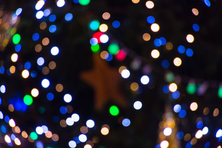 Abstract bokeh background. Sparkling winter decorations lights, at night.の写真素材