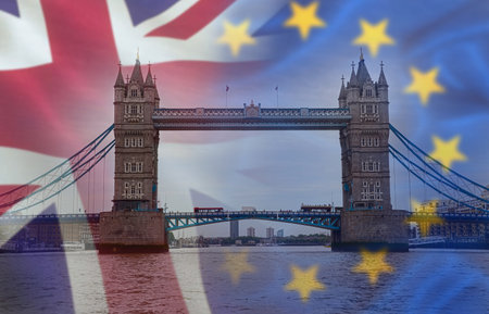 BREXIT conceptual image with flags of United Kingdom and European Union over a image of London.の写真素材