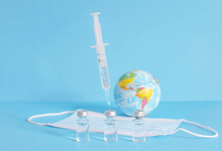 Conceptual photo for worldwide pandemic vaccination, beginning of mass vaccination for 9, influenza or flu, world immunization. Selective focusの写真素材