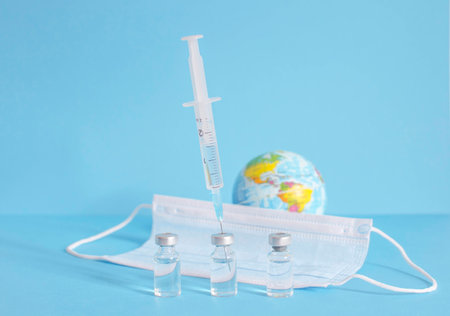 Conceptual photo for worldwide pandemic vaccination, beginning of mass vaccination for coronavirus COVID-19, influenza or flu, world immunization. Selective focusの写真素材