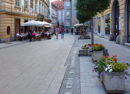 Graz/Austria - June 18, 2019: Pedestrian street with restaurants and shops in the old charming city center of Graz, Styria region, Austria.のeditorial素材