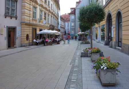 Graz/Austria - June 18, 2019: Pedestrian street with restaurants and shops in the old charming city center of Graz, Styria region, Austria.のeditorial素材