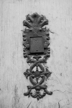 Old metal decorative elements on a wooden door in Graz, Styria region, Austria