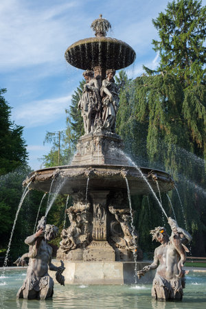 Fountain in the city park Stadtpark, a green island in the middle of the city, in Graz, Styria region, Austria.の写真素材