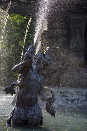 Fountain in the city park Stadtpark, a green island in the middle of the city, in Graz, Styria region, Austria.の写真素材