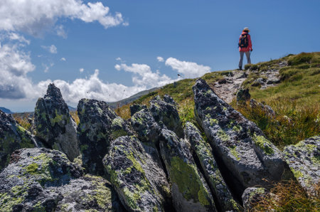 Woman hiking in Retezat National Park, Carpathian Mountains, Romaniaの写真素材