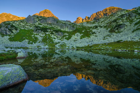 Mountain landscape and glacial lake in Retezat National Park, Carpathian Mountains, Romaniaの写真素材