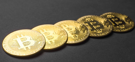 Bitcoin BTC crypto currency gold coins on black background, new virtual money concept. Mining or blockchain technologyの写真素材