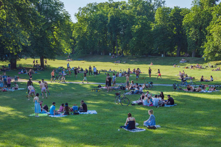 Graz, Austria-June 13, 2020: young people relaxing and playing outdoor games in the park, in summertime, Styria region, Austria. Selective focus.のeditorial素材