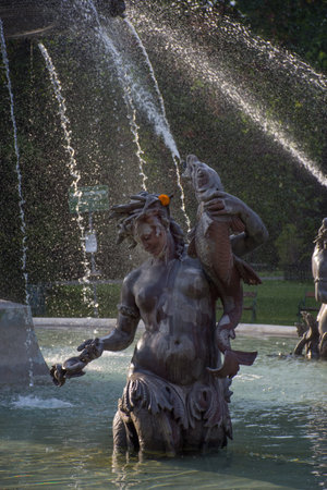 Fountain in the city park Stadtpark, a green island in the middle of the city, in Graz, Styria region, Austria.の写真素材