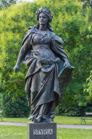 Statue representing Styria in the city park Stadtpark, a green island in the middle of the city, in Graz, Styria region, Austria.のeditorial素材