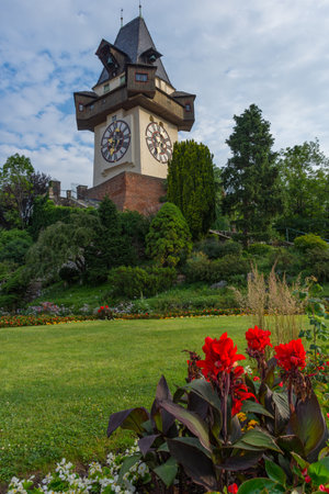 The famous clock tower (Grazer Uhrturm) and gardens on Shlossberg hill before sunrise,in Graz, Styria region, Austriaのeditorial素材