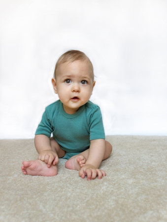 Sweet little baby boy portrait on white backgroundの写真素材